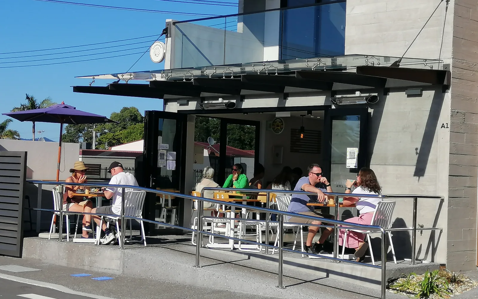 Guests seated outside Kawakawa at Salt on a sunny day